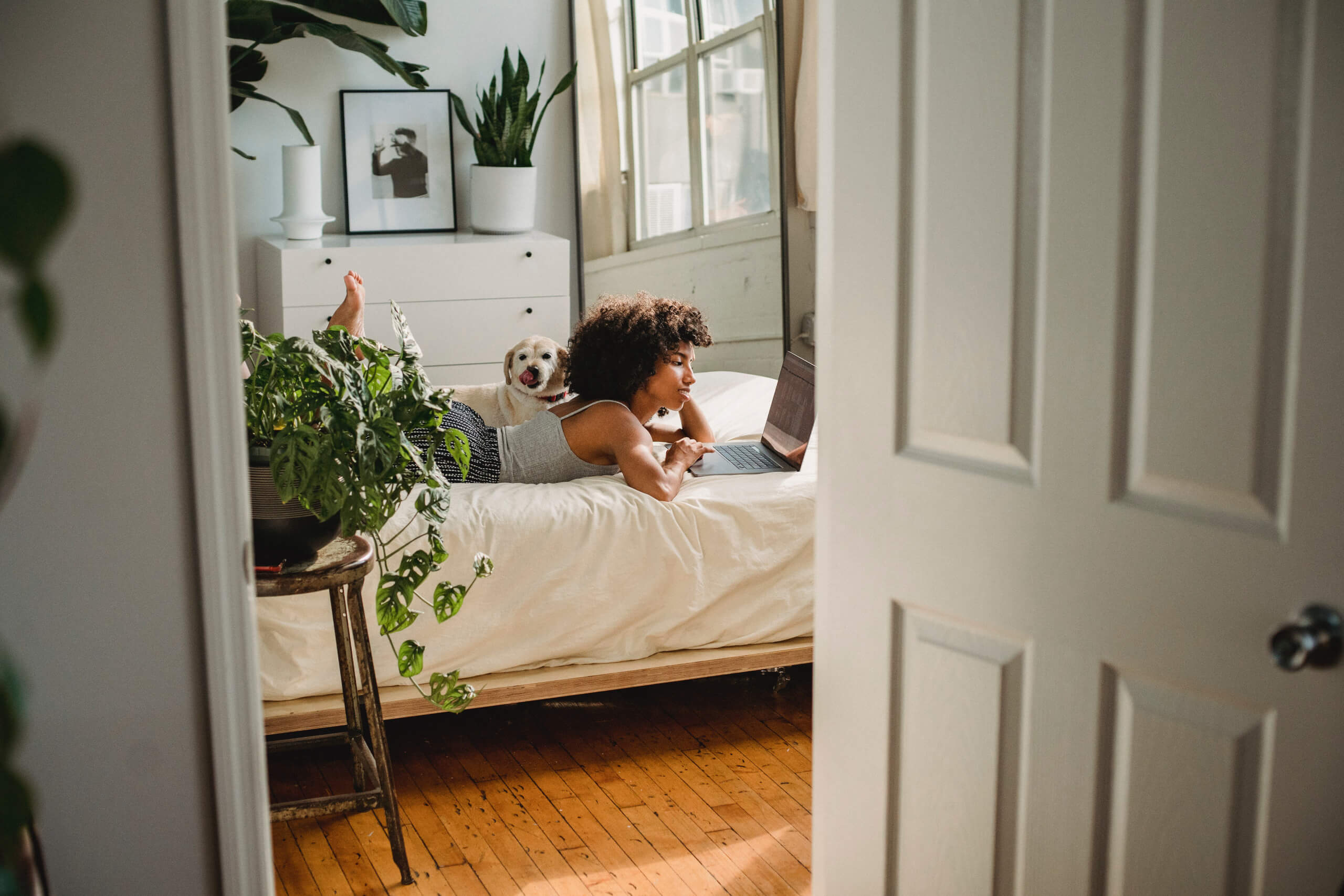 Hero - woman working on her bed.